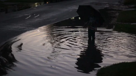 Boy Standing In Puddle Stock Footage 40344185