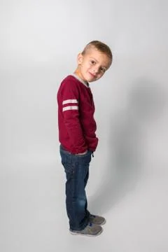 Boy Standing Sideways on White Background Stock-Fotos