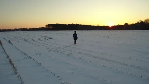 Boy Standing in Snowy Field Video stock 115095818