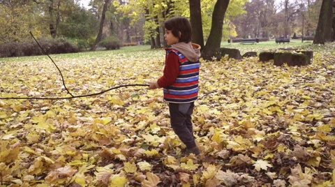 Boy standing with a stick and singing, steadycam shot, slow motion  240fps Stock Footage 44892350
