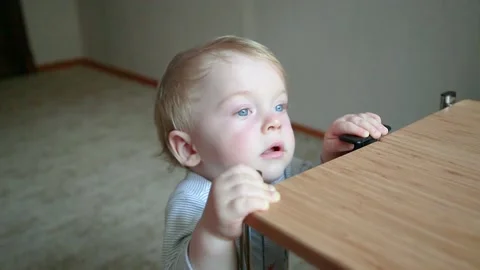 The boy is standing at the table Stock Footage 133952037