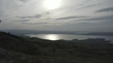 A boy stands alone on a rock Stock Footage 141758801