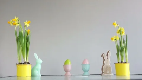 Boy steals an Easter egg, childish pranks. Curly cute schoolboy near the table Stock Footage 102834594