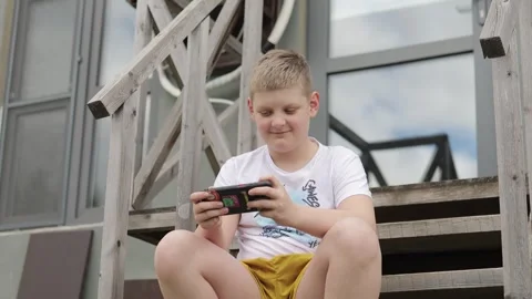 Boy on the steps Stock Footage 274938509