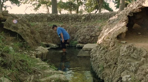 Boy Steps into Spring Water 스톡 동영상 53181280