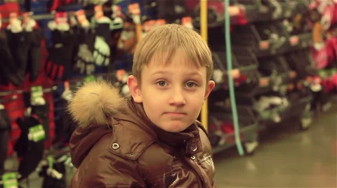 Boy in the store looking at the camera and smile Stock-Footage 57508851