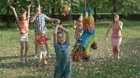Boy Striking Pinata | Stock Video | Pond5