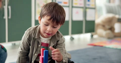 Boy, student and play with blocks in classroom for learning, problem solving and Stock Footage 306509271