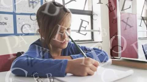 Boy student bringing pencil to paper, doing math while faint letters drifting Stockbeeldmateriaal 335466057
