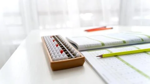 Boy student doing mental arithmetic on the abacus Stock Photos
