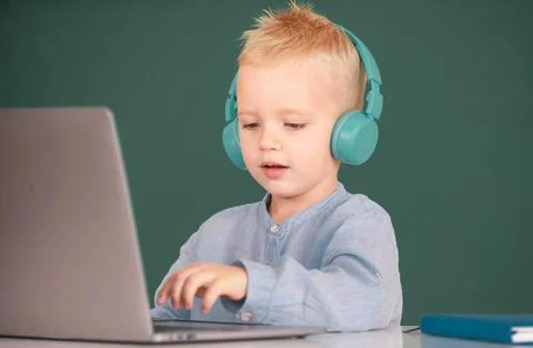 Boy student learning online in class. Kid study online video call with zoom Stock Photos