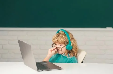 Boy student learning online in class. Kid study online video call with zoom Stock Photos