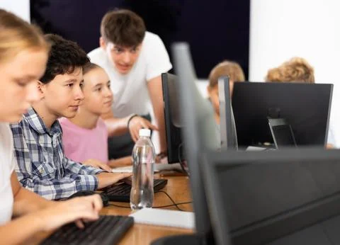 Boy student learning to work on computer in classroom 스톡 사진