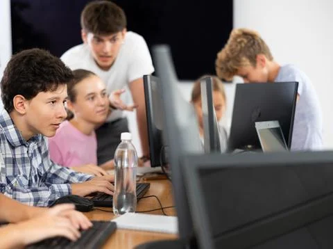 Boy student learning to work on computer in classroom 스톡 사진