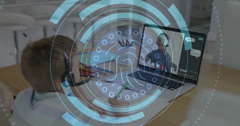 Boy student wearing headset at table holding pencil, joining e-learning call Stock Footage 309111182