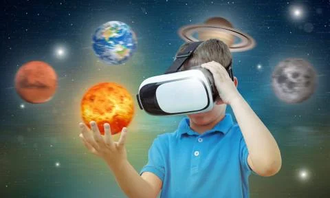 Boy studies space with the help of technology and the app. Virtual reality he Stock Photos