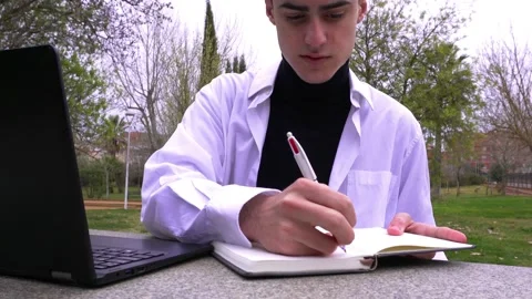 Boy studying on campus Stock Footage 171979958