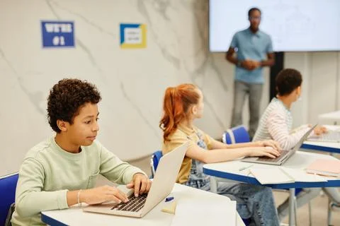 Boy Studying in Class Stock Photos
