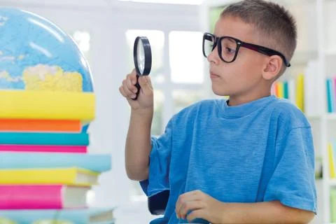 Boy studying geography Stock Photos