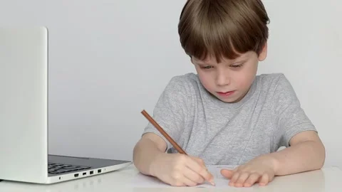 Boy studying at home online use laptop Stock Footage 237919545