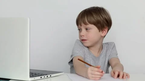 Boy studying at home online use laptop Stock Footage 237919560