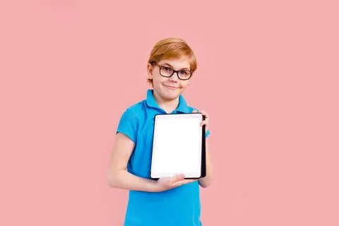 Boy studying homework with tablet pc during his online lesson at home, soci.. Stock Photos