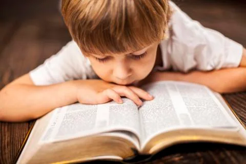 Boy studying the scriptures. Stock Photos