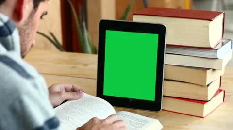Boy studying with tablet (with green screen) Stock Footage 10895073