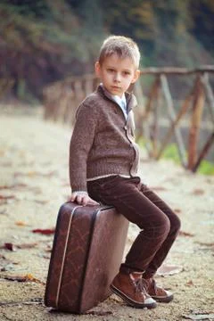 Boy  with suitcase. Stock Photos
