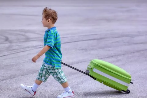 A boy with a suitcase Stock Photos