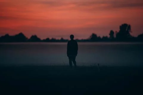 Boy at sunset Stock Photos