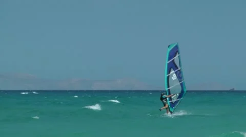 Boy on surfboard fall Stockbeeldmateriaal 8985713