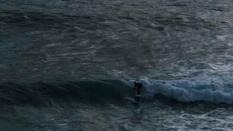 Boy surfing and then falling in the ocean. Person on a surfboard in Portugal. Stock Footage 150840623