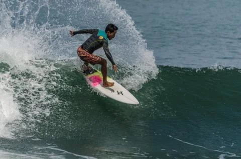 Boy surfing wave Stock Photos