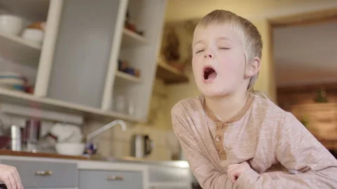 Boy surprised as tooth is pulled out using string attached to RC car Video stock 293777130
