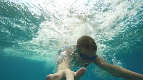 Boy swim in the sea Stock Footage 65775100