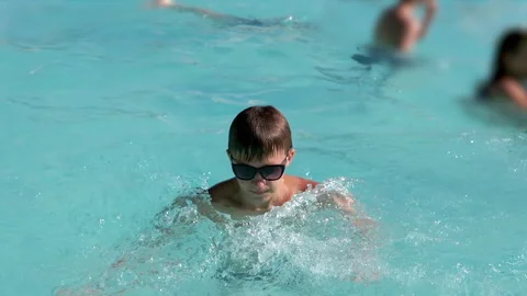 Boy Swimming and Diving in Pool Stock Footage 293211933
