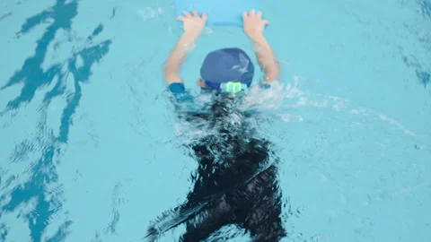 Boy swimming in the pool with foam Stock-Footage 150690550