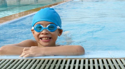 Boy swimming in pool Stock Footage 61948975