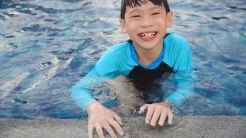Boy swimming at pool Stock Footage 75524783