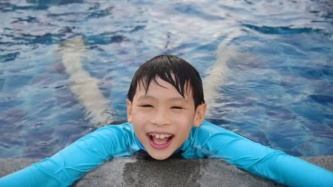 Boy swimming at pool Stock Footage 75524801