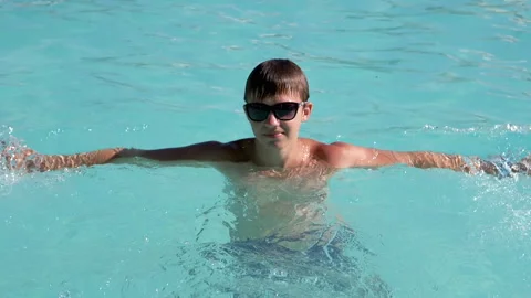 Boy Swimming in Pool Stock Footage 293225451