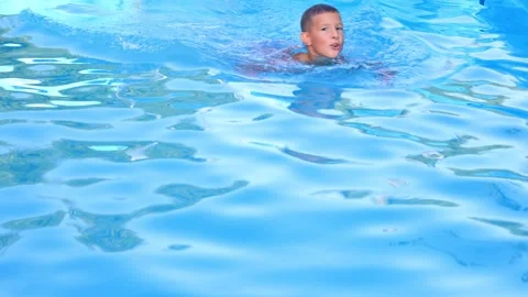 A boy is swimming in the pool Stock-Footage 315030610