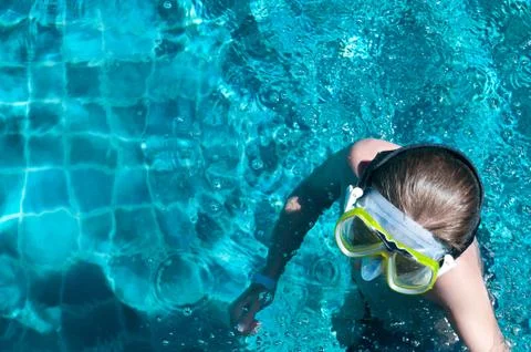 Boy in the swimming pool Stock Photos