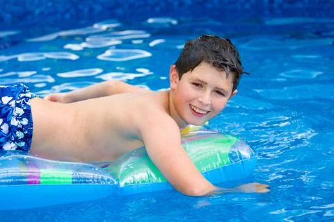 Boy in swimming pool Stock Photos