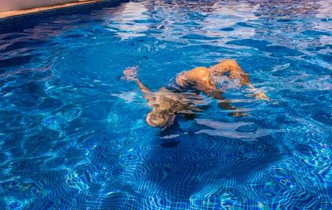 Boy in a swimming pool Stock Photos