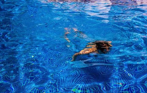 Boy in a swimming pool Stock Photos