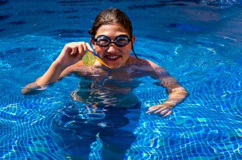 Boy in a swimming pool Stock Photos