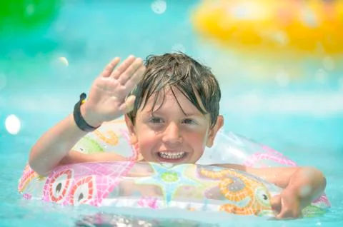 Boy on Swimming Ring Foto stock
