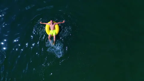 Boy swimming with swim ring Stock Footage 134802946
